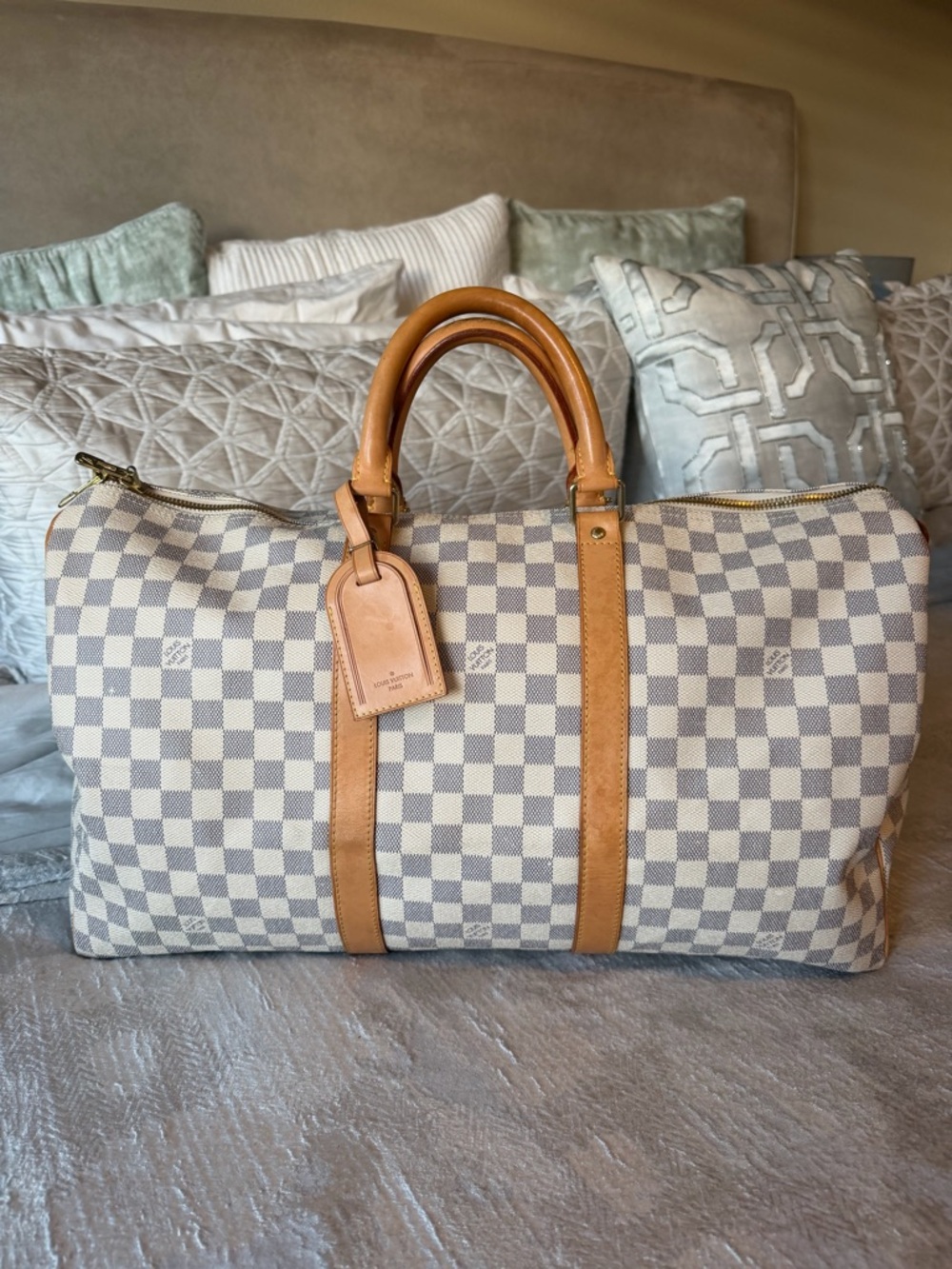 This item is a Louis Vuitton Damier Azur Keepall Duffel Bag 50